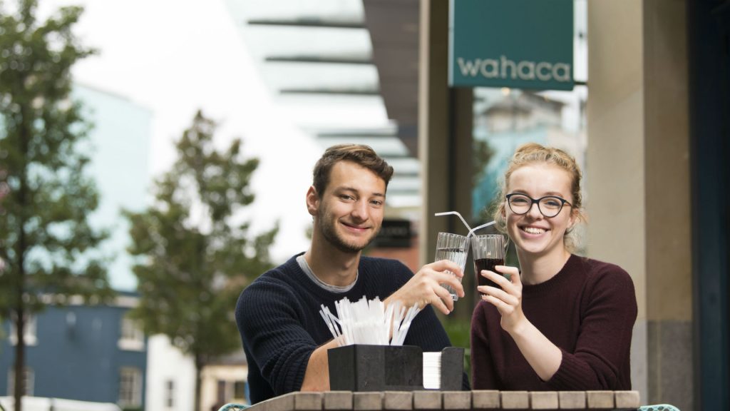 Nia and Douglas raise a glass outside Wahaca's Cardiff restaurant