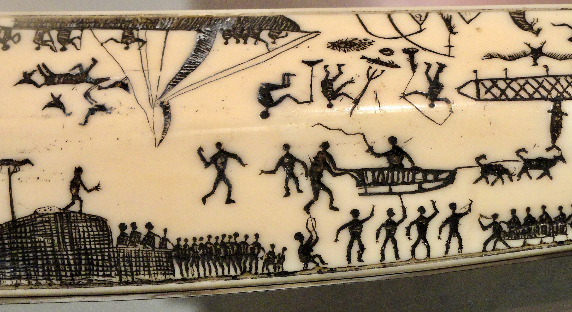 A tobacco pipe from the early 1800s shows scrimshawed scenes of Bering Strait life. (Wikimedia Commons / Peabody Museum)