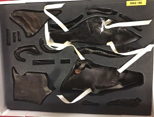 Pieces of a leather shoe from the ship, now carefully stored in plastazote.