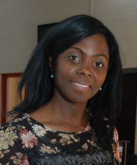 Head-and-shoulders shot of a lady smiling into the camera