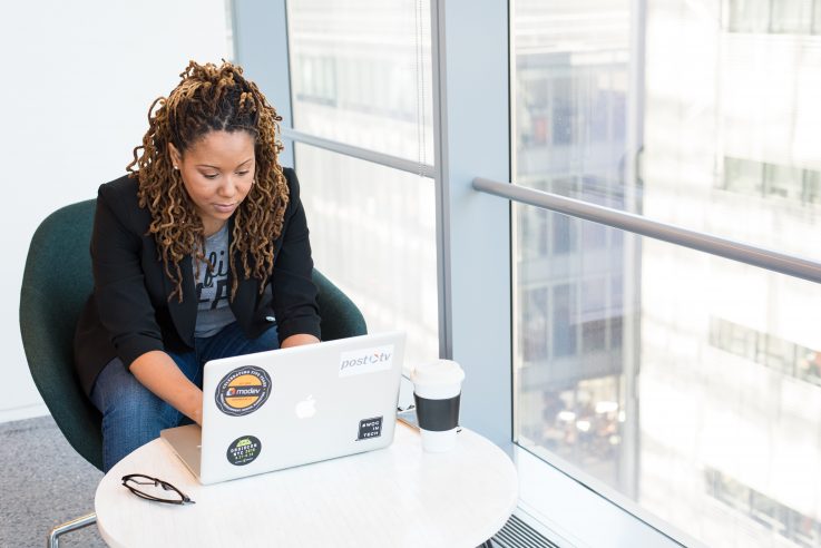 Woman using a laptop in an office