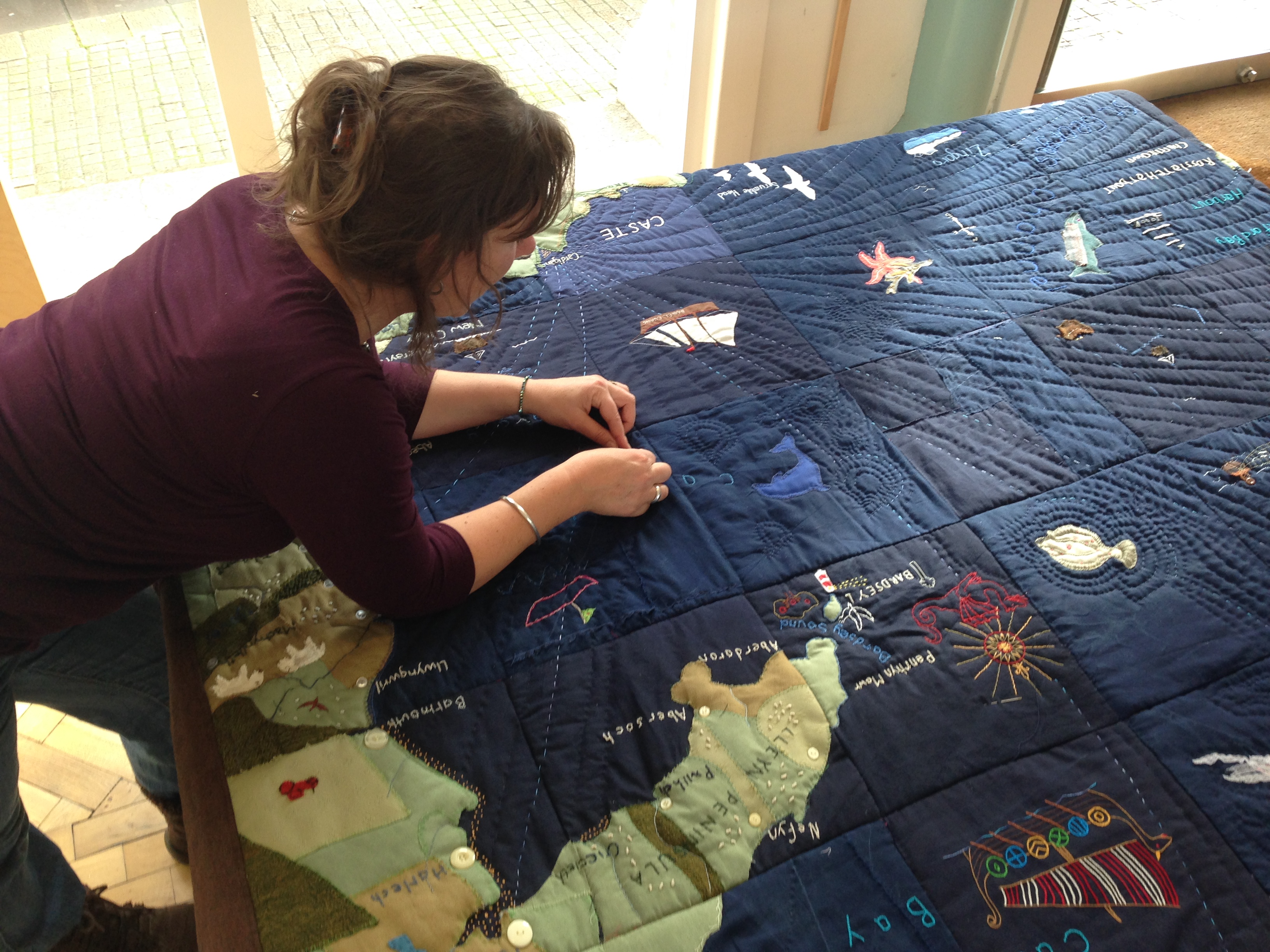 Cardigan Seaquilt showing shipping lanes with community artist Lisa Hellier