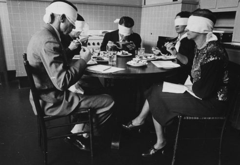 Blindfolded focus group in mock kitchen taste testing meats at the Department of Agriculture Beltsville, Maryland, Maryland, 1935. From the New York Public Library. (Photo by Smith Collection/Gado/Getty Images).