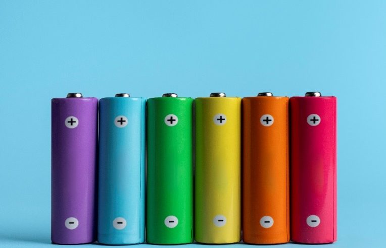 AA size batteries in a range of rainbow colours