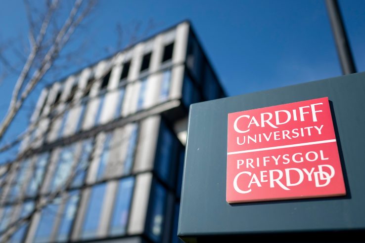 a view of the Cardiff University logo in front of the sbarc|spark building