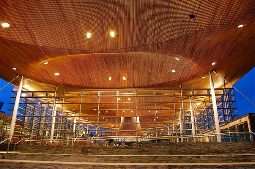 Image of the Senedd at dusk, from the steps, towards the roof.