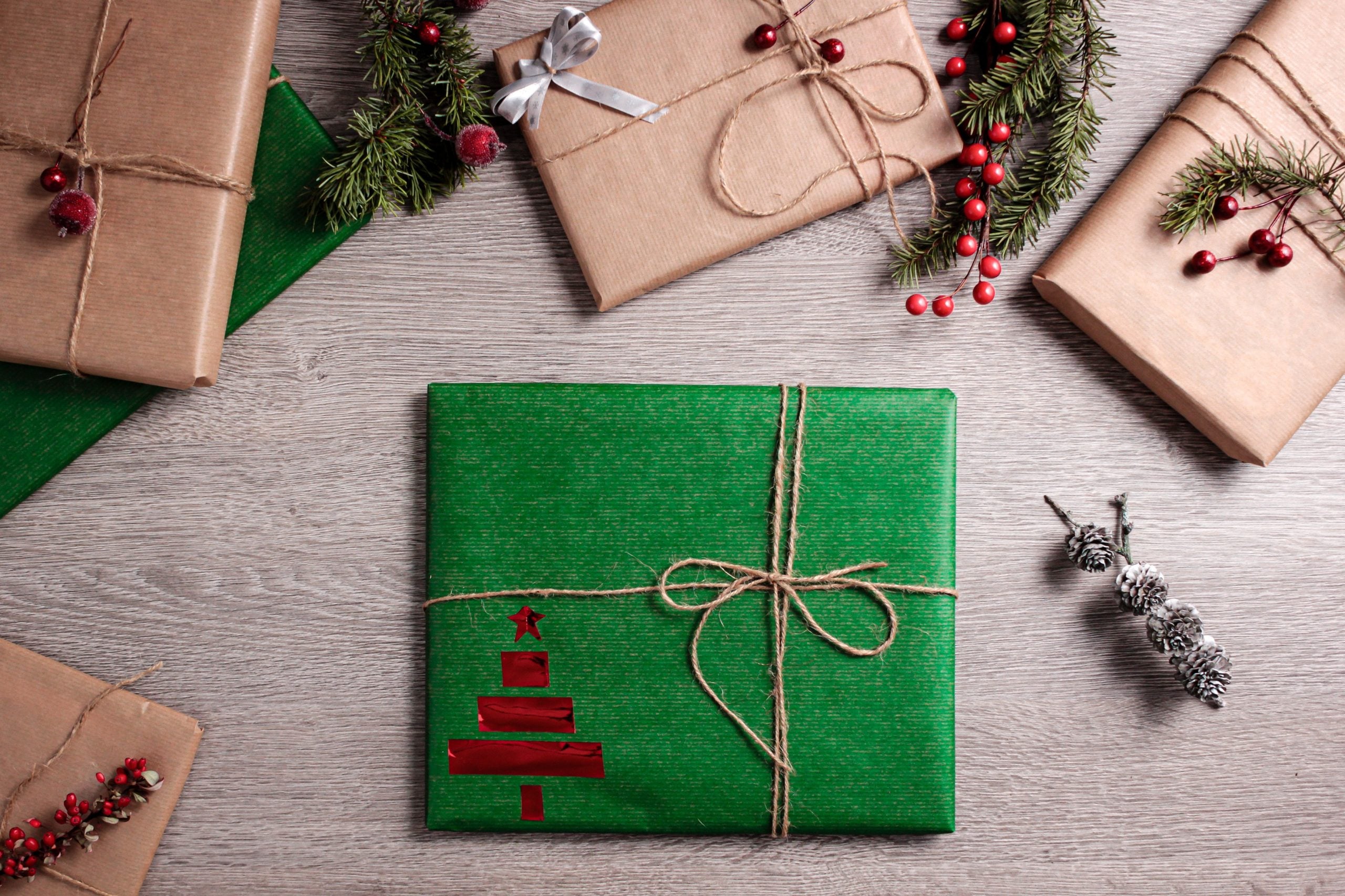 green wrapped Christmas present on a table